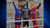 Superhero window washers bring smiles to faces of young patients at Shriners Children’s Boston