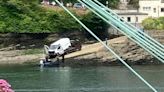 Van plunges into river from slipway