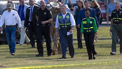 Teen accused in Georgia shooting rode to school with assault rifle hidden in his backpack, investigators say