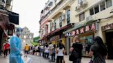 Macau extends COVID shutdown of city, casinos stay open