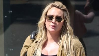 Pregnant Hilary Duff holds hands with daughters Banks, 5, and Mae, 3, during shopping spree at Claires... after husband Matthew Koma underwent a vasectomy