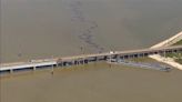 Barge slams into Galveston bridge causing collapse as oil spills into water below