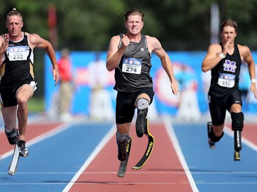 Hunter Woodhall watched his wife become Olympic champion in Paris. Now, he’s a Paralympic gold medalist | CNN