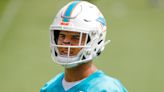 Dolphins orange jersey for practice player of the day tracker