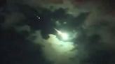Watch moment mystery GREEN meteor blazes over city in front of shocked crowd