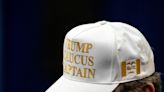 Donald Trump campaign gives white and gold hats to caucus captains in Iowa