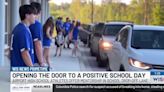 Local student athletes help open the door to a positive day at school