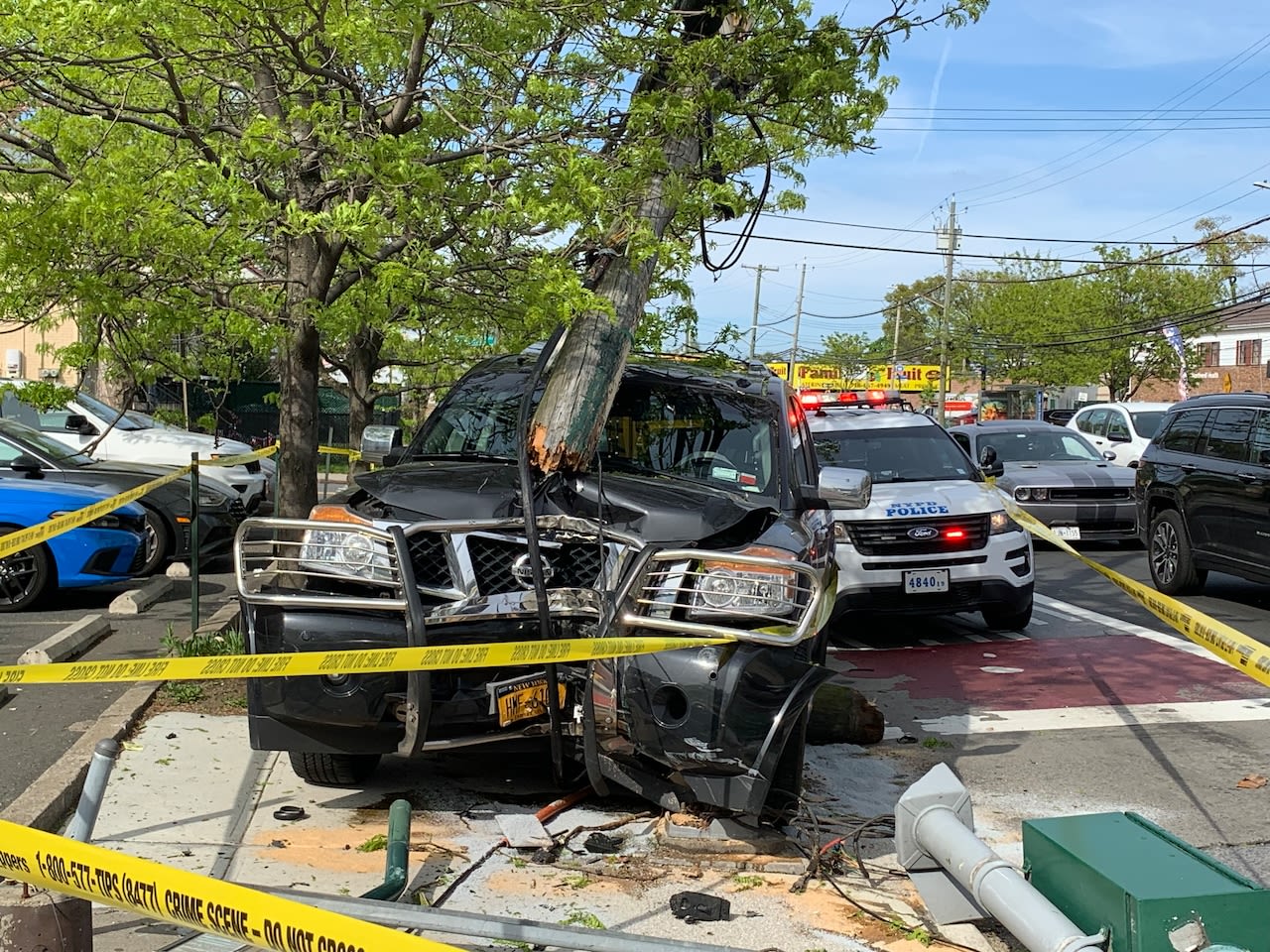 SUV snaps pole in New Dorp crash; 1 taken to hospital