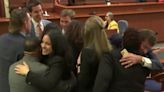 Johnny Depp's legal team hugs after jury finds Amber Heard liable for defamation and awards Depp $15 million