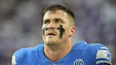 Detroit Lions defensive lineman John Cominsky carted off field with right knee injury