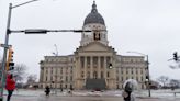 With snow blanketing Topeka, Kansas governor sends state employees home for remote work