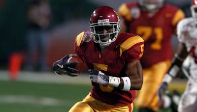 Reggie Bush reacts after Heisman Trophy reinstated