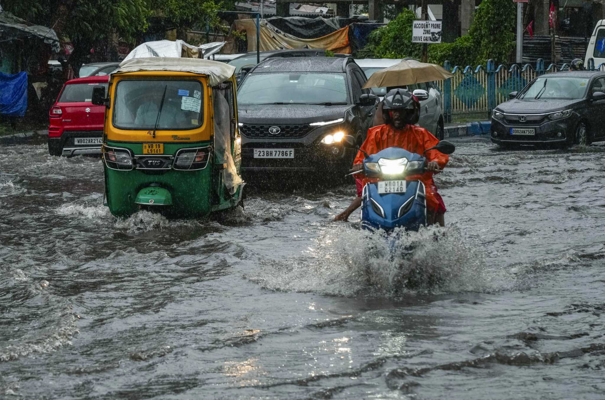 Tropical storm floods villages, blows away thatched roofs and cuts power in Bangladesh and India