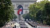 France celebrates national day as political crisis rumbles on