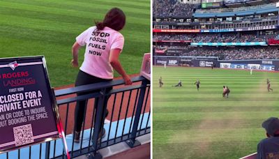 Activists tackled after rushing Rogers Centre field during Toronto Blue Jays game