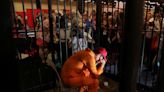 Marjorie Taylor Greene prayed over a convicted Capitol rioter who spent a day crying in a mock prison cell at CPAC