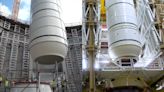 Rocket motor lifted for shuttle Endeavour exhibit as NASA preps lift for Artemis 2