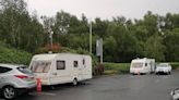 Traveller caravans pitch up shop car park on one of busiest days of the year