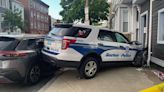 Boston police cruiser struck a building while responding to call for a man with gun