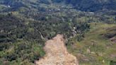 Papua New Guinea's prime minister visits the site of a landslide estimated to have killed hundreds