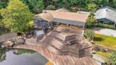 Travelers Rest home's deck features 5 levels, gazebo and diving board into private lake