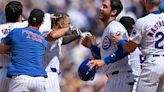The Chicago Cubs' Cody Bellinger, middle, celebrates after scoring in the ninth inning against the Pittsburgh Pirates at Wrigley Field on Saturday, May 18, 2024 in Chicago.