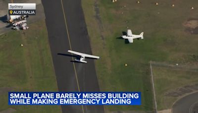 Small plane loses power and skims suburban rooftops before making crash landing on belly | VIDEO