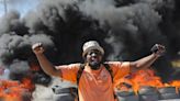 Haiti police block streets, break into airport to protest officer killings