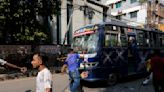 Thousands of Bangladesh’s garment factory workers take to the streets demanding better wages