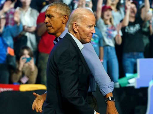 Obama looms large in Democratic debate over Biden