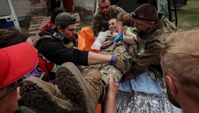 Ukraine reinforces border as thousands flee invading Russians