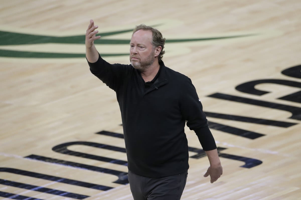 Mike Budenholzer is hired as coach of the Phoenix Suns, replacing Frank Vogel