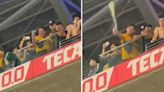 Vile fan PEES in cup and splashes supporters below as police investigate