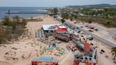 See Lake Michigan beach views of The Deck from a drone