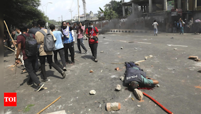 Bangladesh security forces fire bullets and sound grenades as protests escalate - Times of India