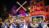 The Windmills Are Back Up on the Moulin Rouge