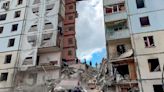 An apartment block collapses in a Russian border city after heavy shelling, with deaths reported