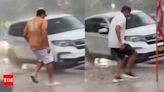 Watch: Rohit Sharma and Rahul Dravid dash through rain to catch cab in New York | Cricket News - Times of India