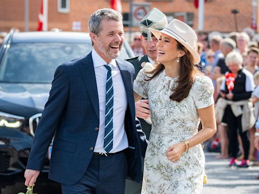 King Frederik and Queen Mary are all giggles as they move for the summer holidays