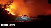 Vehicle drives through intense wildfire in California