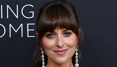 Dakota Johnson appears WITHOUT her engagement ring