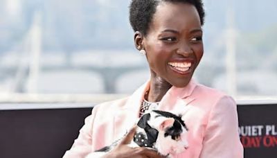 Lupita Nyong’o Trades Her Cat Purse for a Real Cat on the Red Carpet