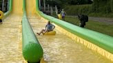 Sir Ed Davey defends election stunts as he races down water slide in rubber ring