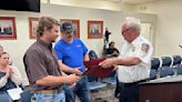 Quick-acting utility men who pulled man from vehicle after crash honored by Zachary fire chief