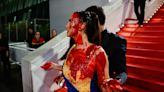 Ukrainian Protester Pulled Off Cannes Red Carpet After Covering Herself in Fake Blood