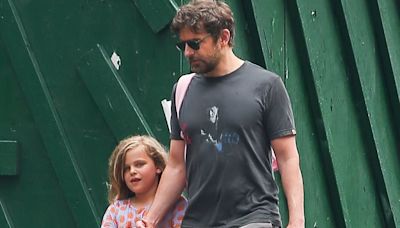 Bradley Cooper walks hand-in-hand with his daughter Lea, 7, in NYC