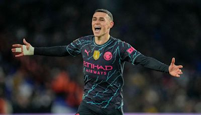 Man City beats Brighton 4-0 to stay on course for another Premier League title. Phil Foden scores 2