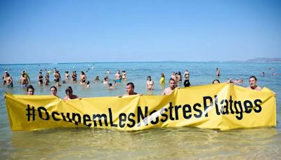 Anti-tourism protesters storm popular Majorca beach loved by UK tourists