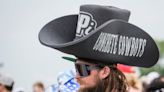 People wore oversized cowboy hats and Halloween masks, among other things, at 108th Indy 500