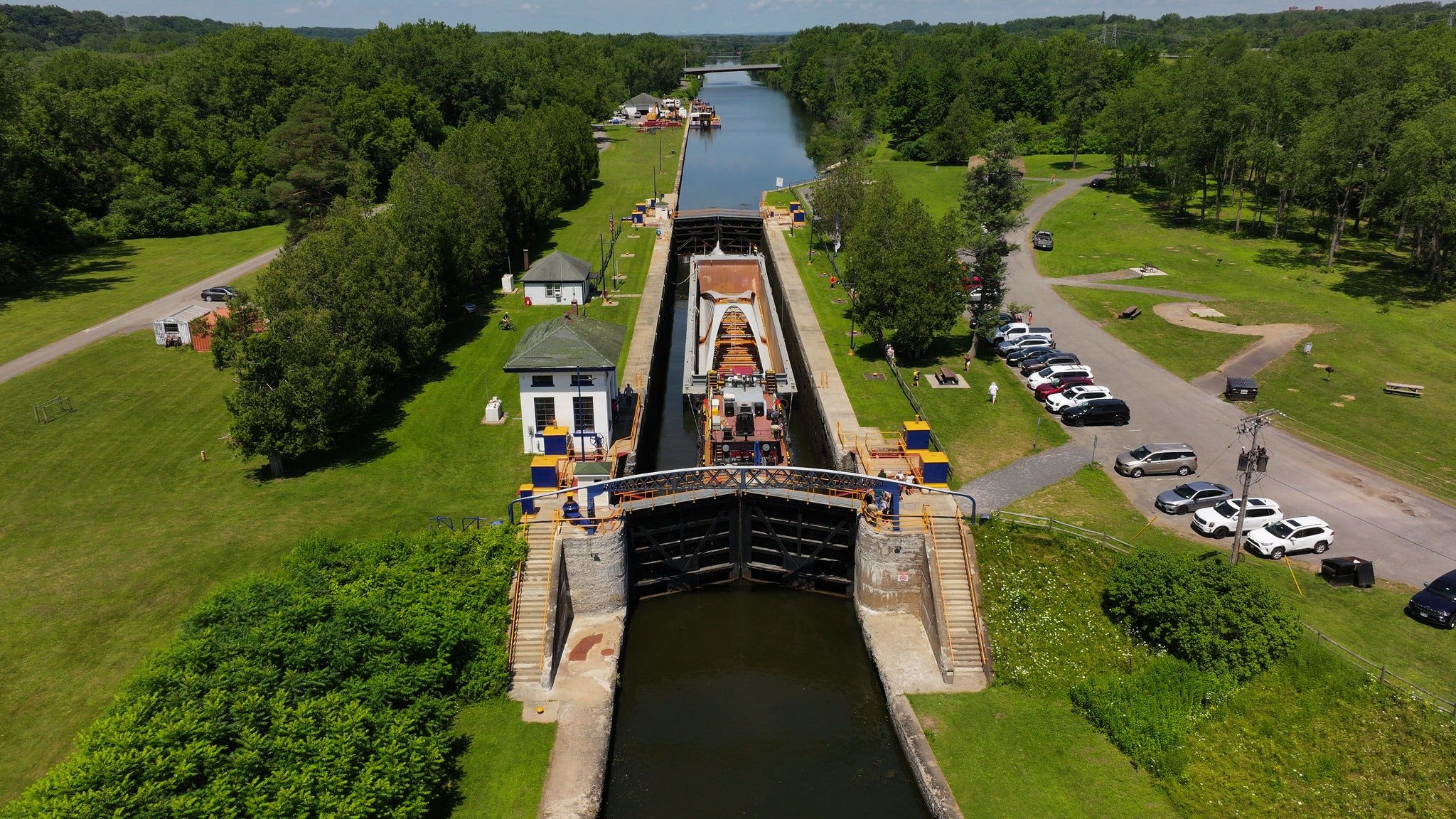 Where to see the barge carrying a pedestrian bridge on the Erie Canal near Rochester